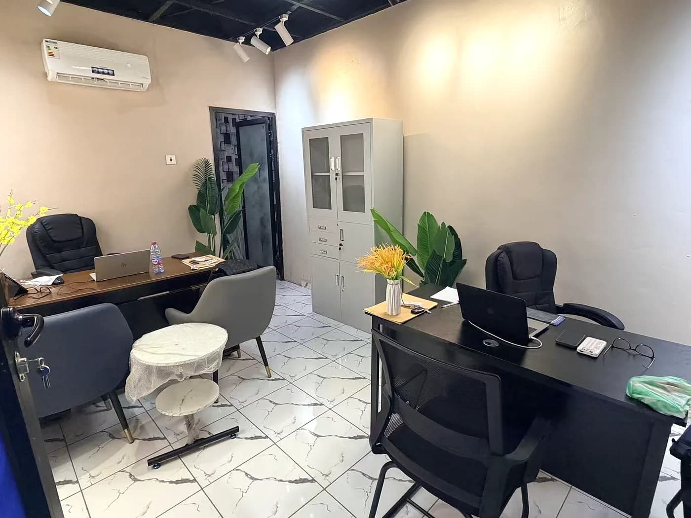 The Not By Might office in Asafo, Kumasi, with desks and seating for clients